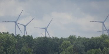 Wind turbines in the stormy sky