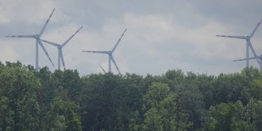 Wind turbines in the stormy sky